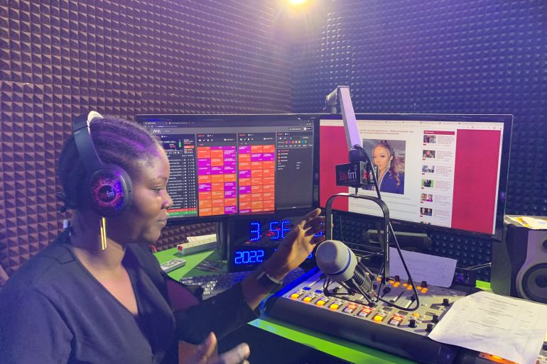 A woman hosts a radio show
