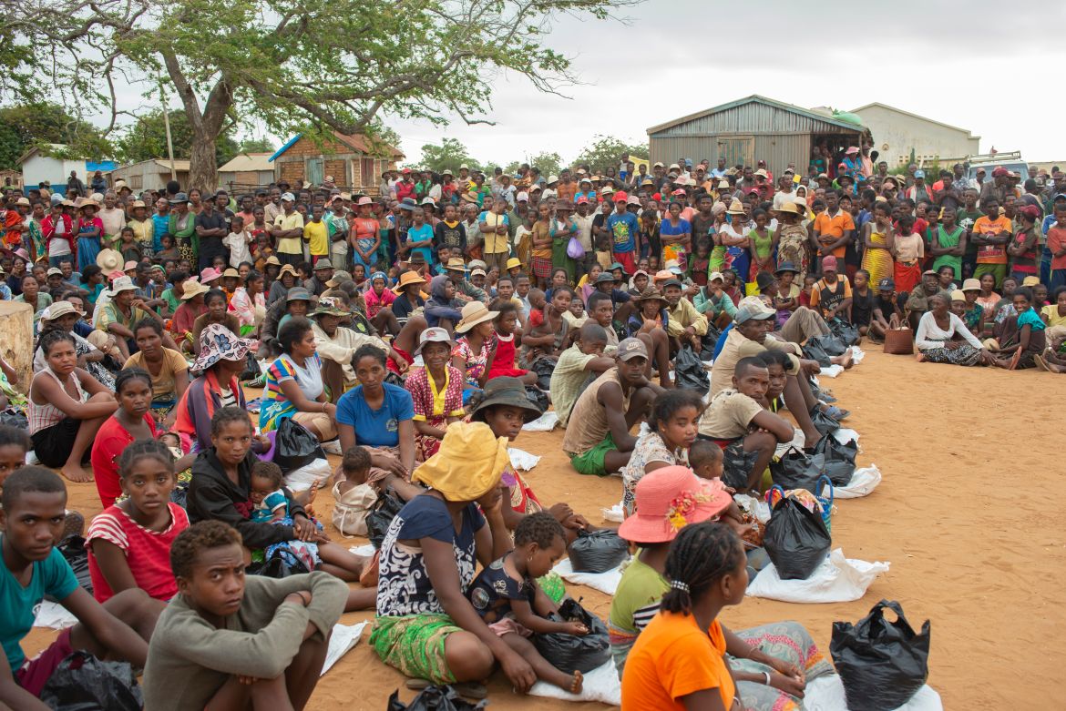 Residents of Androy Province gather for a government aid distribution event in Maraoalomainte village. [Joseph Stepansky/Al Jazeera]