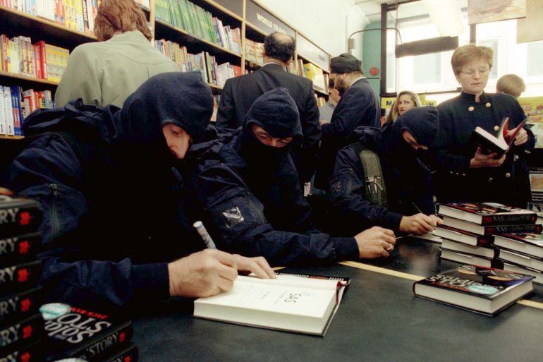 Former members of the elite SAS regiment in a London bookshop in 1996 sign copies of their book, 'SAS: The Soldiers Story' [File photo: PA Images via Reuters]