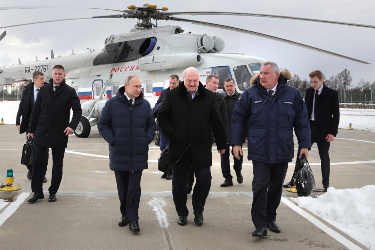 Russian President Vladimir Putin walks with Belarusian President Alexander Lukashenko and Roscosmos head Dmitry Rogozin after arriving at the Vostochny cosmodrome.