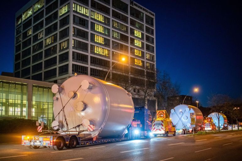 Trucks transport fuel tanks through the streets of the St. Pauli district of Hamburg, Germany
