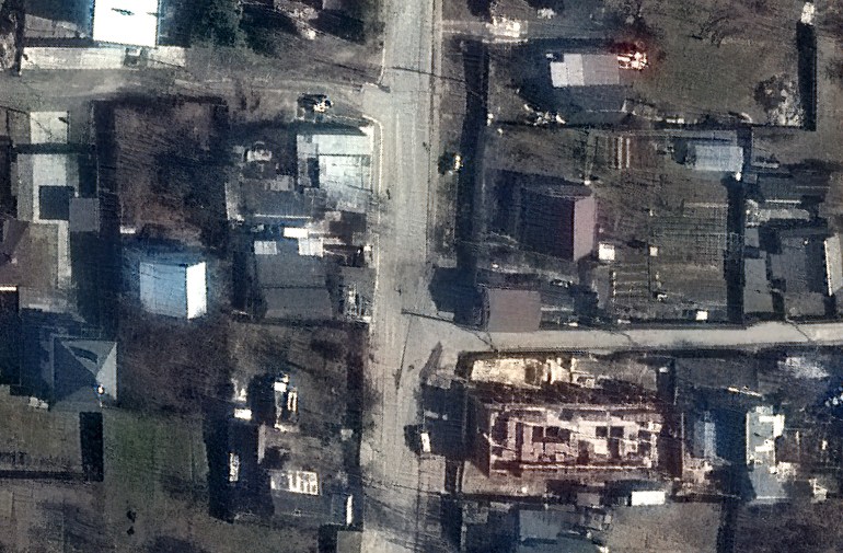 A handout satellite image made available by Maxar Technologies shows what appears to be the bodies of several civilians along Yablonska Street in Bucha