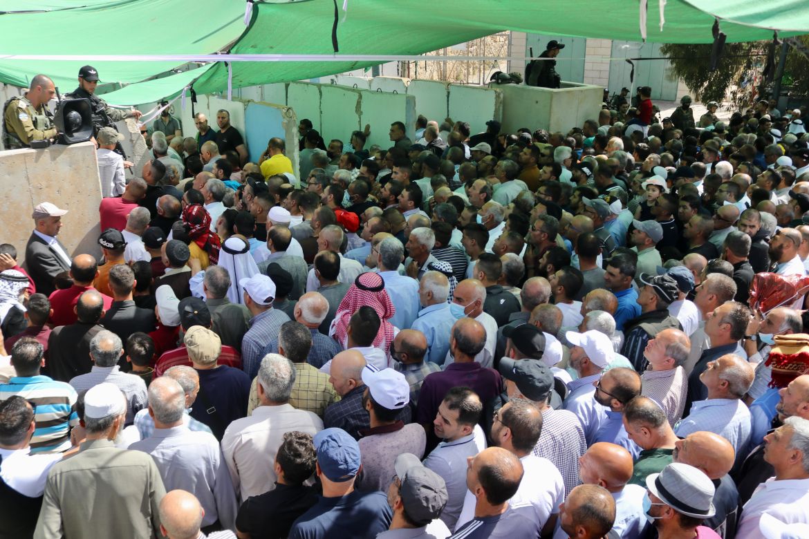 Palestinians waiting at the Qalandiya checkpoint