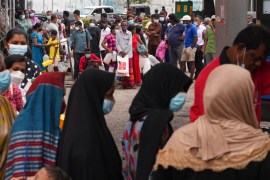 Sri Lankans queue up near a fuel station to buy kerosene in Colombo, Sri Lanka