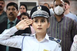 Policewoman standing in salute