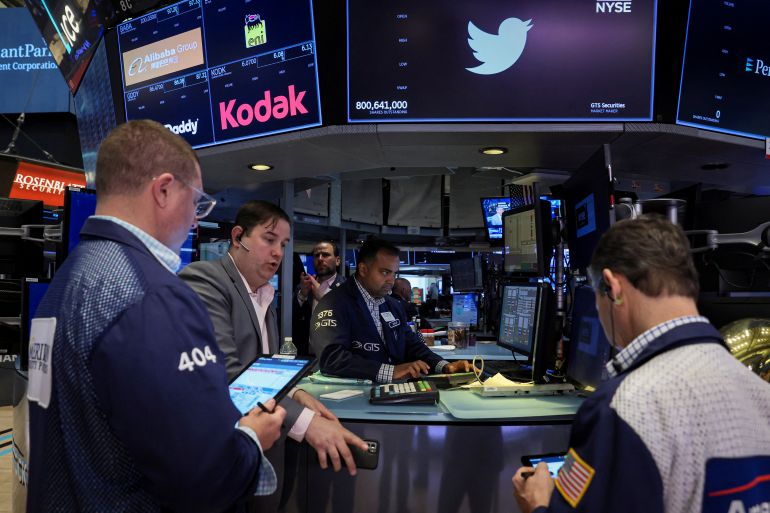 Traders buy and sell shares of Twitter at the opening bell on the floor of the New York Stock Exchange
