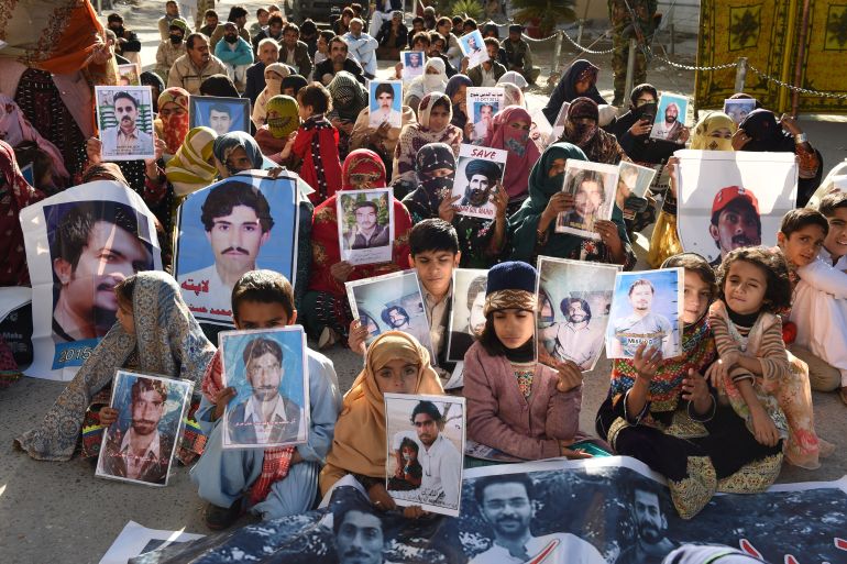 Relatives of missing Pakistanis hold pictures of their loved ones