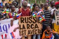 Holding placards with pro Russian slogans, demonstrators gather in Bangui on March 5, 2022 during a rally in support of Russia.