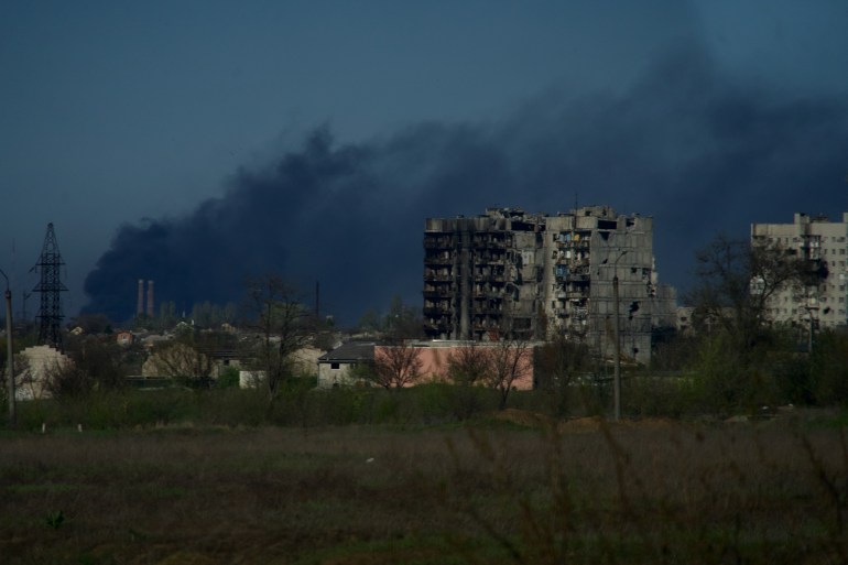 Smoke rises from the grounds of the Azovstal steel plant in the city of Mariupol on April 29, 2022 [Andrey Borodulin/AFP]