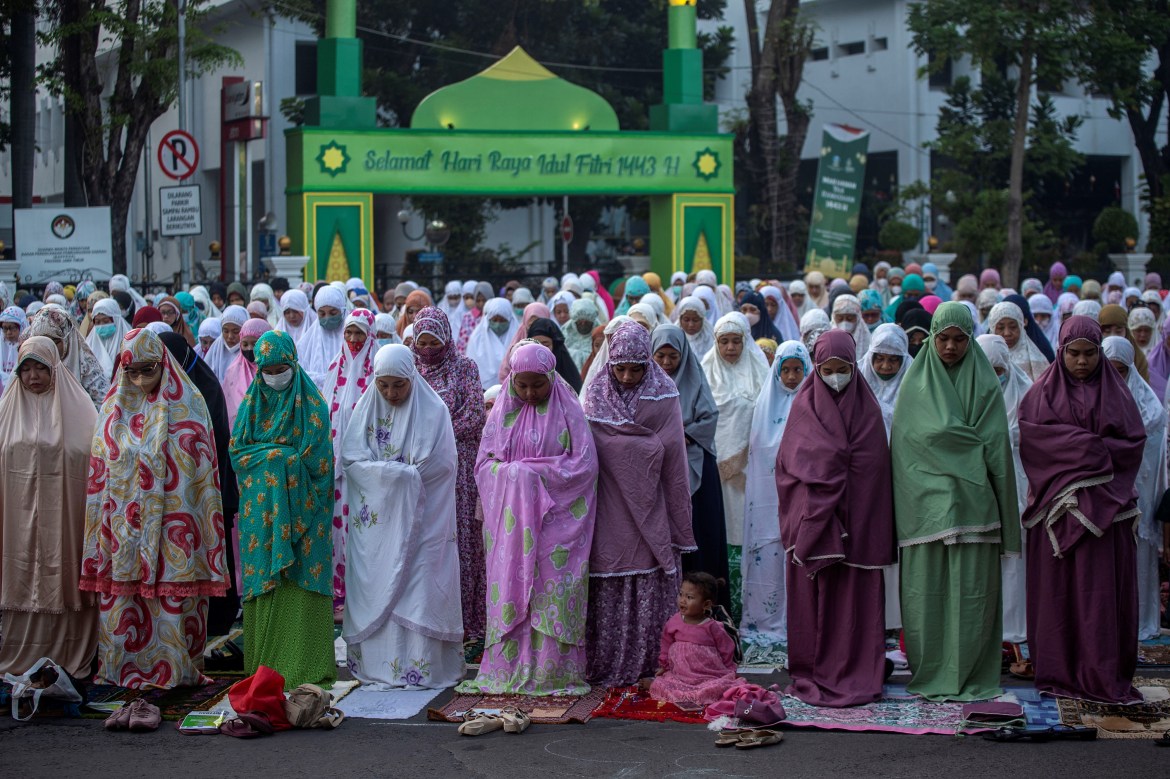 Muslims pray during Eid al-Fitr which marks the end of the holy month of Ramadan in Surabaya