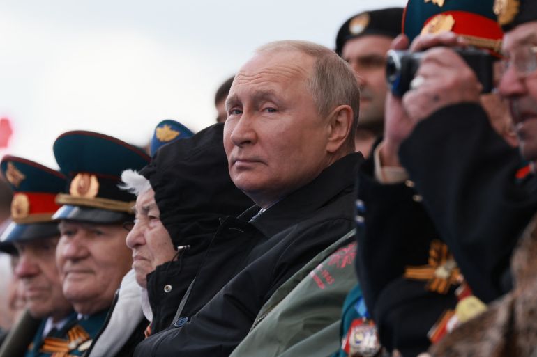 Russian President Vladimir Putin watches the Victory Day military parade at Red Square in central Moscow on May 9, 2022. - Russia celebrates the 77th anniversary of the victory over Nazi Germany during World War II.