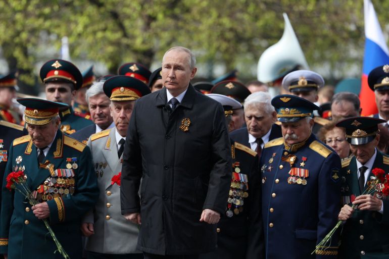 Russian President Vladimir Putin attends a flower-laying ceremony