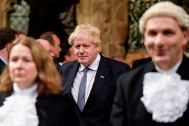 Britain's Prime Minister Boris Johnson processes through the House of Commons Members' Lobby