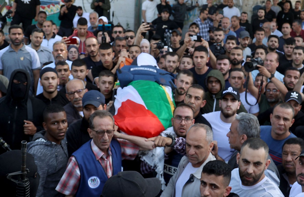 Mourners carry the body of veteran Al Jazeera Palestinian journalist Shireen Abu Aqleh