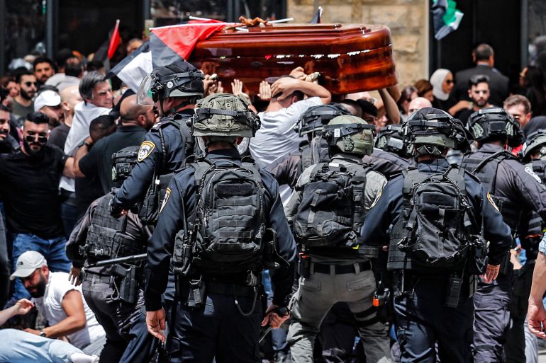Violence erupts between Israeli security and mourners carrying the coffin of slain Al Jazeera journalist Shireen Abu Akleh out of a hospital, before being transported to a church and then her resting place, in Jerusalem, on May 13, 2022