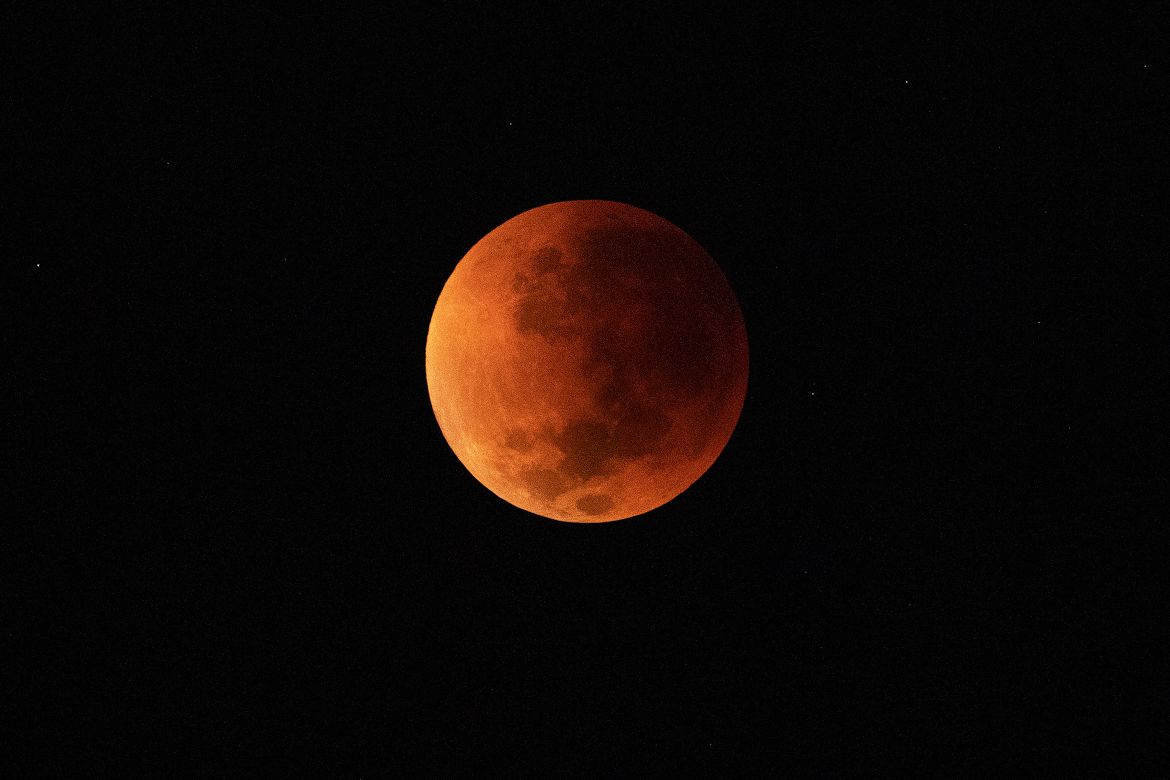 The blood moon is seen during a total lunar eclipse in Rio de Janeiro