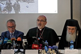 Latin Patriarch of Jerusalem Pierbattista Pizzaballa, centre, speaks during a news conference while accompanied by Greek Orthodox Patriarch of Jerusalem Theophilos III, right, and General Director of Saint Joseph Hospital Jamil Koussa, left, regarding the events at the funeral of slain Al Jazeera journalist Shireen Abu Akleh [Ahmad Gharabli/AFP]