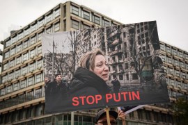 A protester holds a placard that reads &#39;Stop Putin&#39; during a demonstration against Russia&#39;s military invasion of Ukraine, in Belgrade, Serbia on May 28, 2022 [Oliver Bunic/AFP]