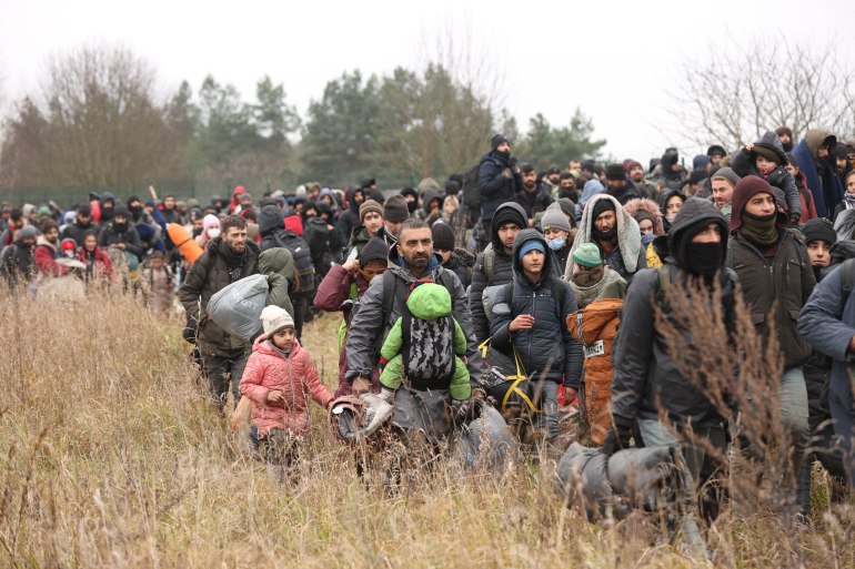 Migrants gather on the Belarusian-Polish border near the Polish border crossing in Kuznica on November 15, 2021.