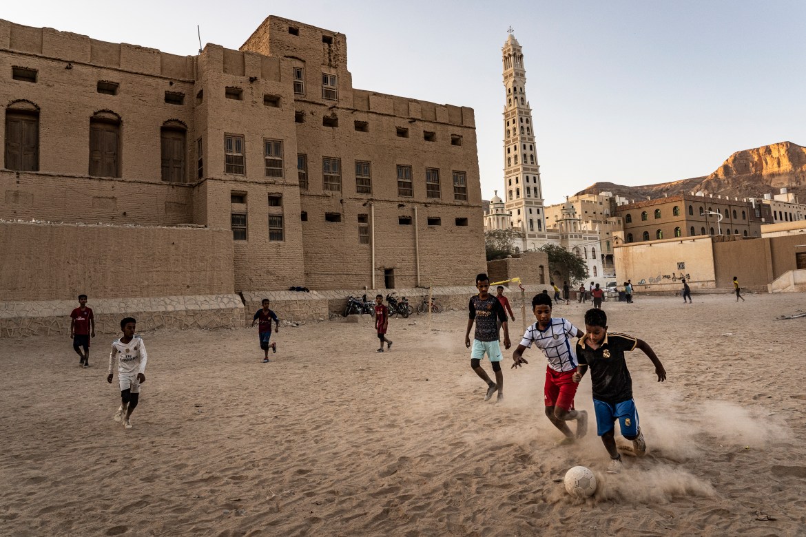 Boys play football at sunset in Tarim, Hadhramaut.