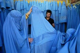 An Afghan woman looks at merchandise at a burqa shop in Herat in western Afghanistan.