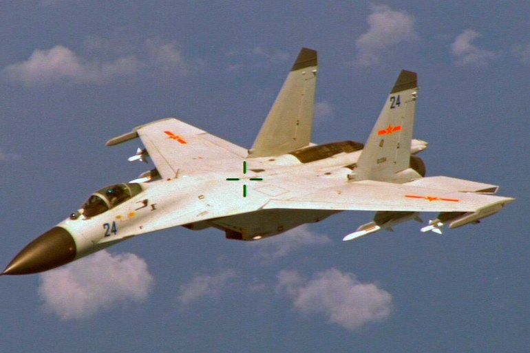 A Chinese J-11 fighter jet flying.