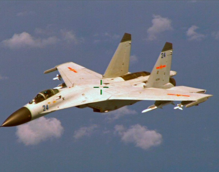 A Chinese J-11 fighter jet flying.