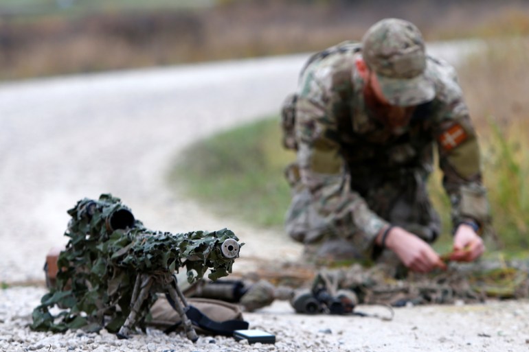 A Danish soldier is seen preparing his weapon for a sniper competition at the US military base in Grafenwoehr, Germany