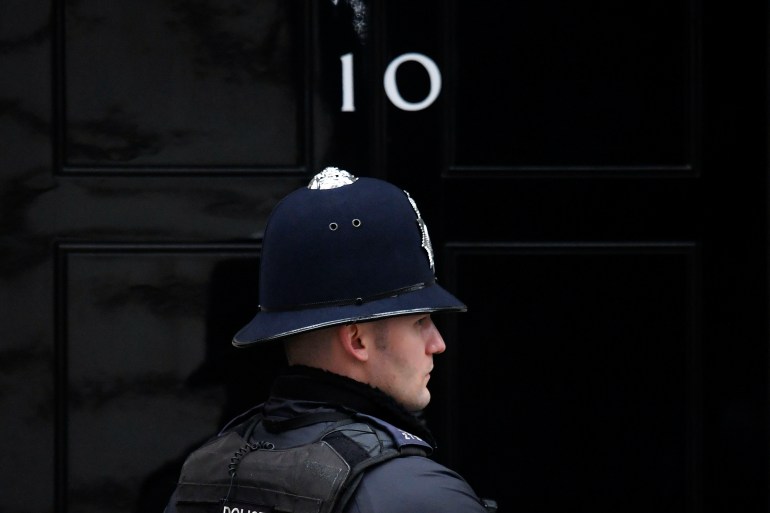 A police officer stands on duty outside 10 Downing Street in London, the UK.