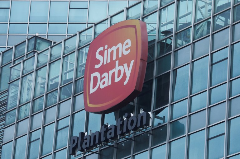 Sime Darby Plantation Berhad sign on a building.