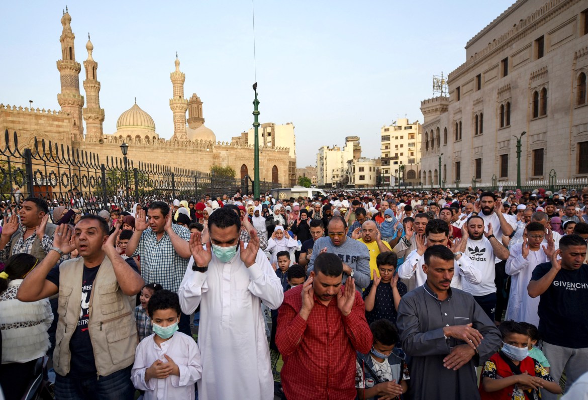Muslims gather for Eid al-Fitr prayer outside Al-Azhar Mosque in Cairo, Egypt