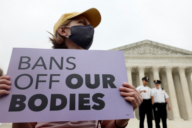 A demonstrator holds a sign outside the US Supreme Court