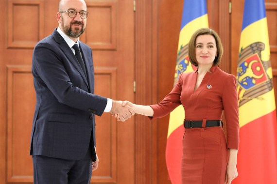 Moldovan President Maia Sandu shakes hands with European Council President Charles Michel