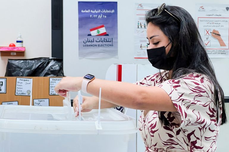 A Lebanese expat casts her vote in Lebanon's parliamentary election at the Lebanese school in Doha, Qata