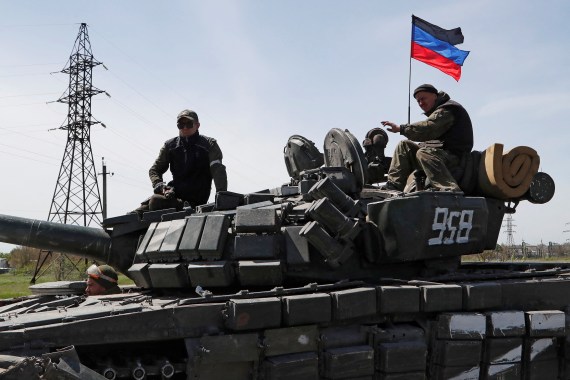 Pro-Russian troops are seen driving a tank in Ukraine's eastern Donetsk region.