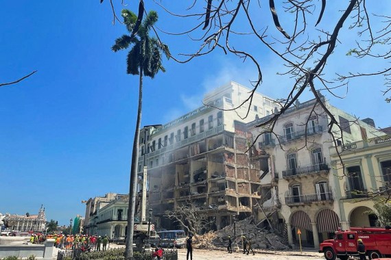 rescue teams work at site of an explosion at a hotel in Havana