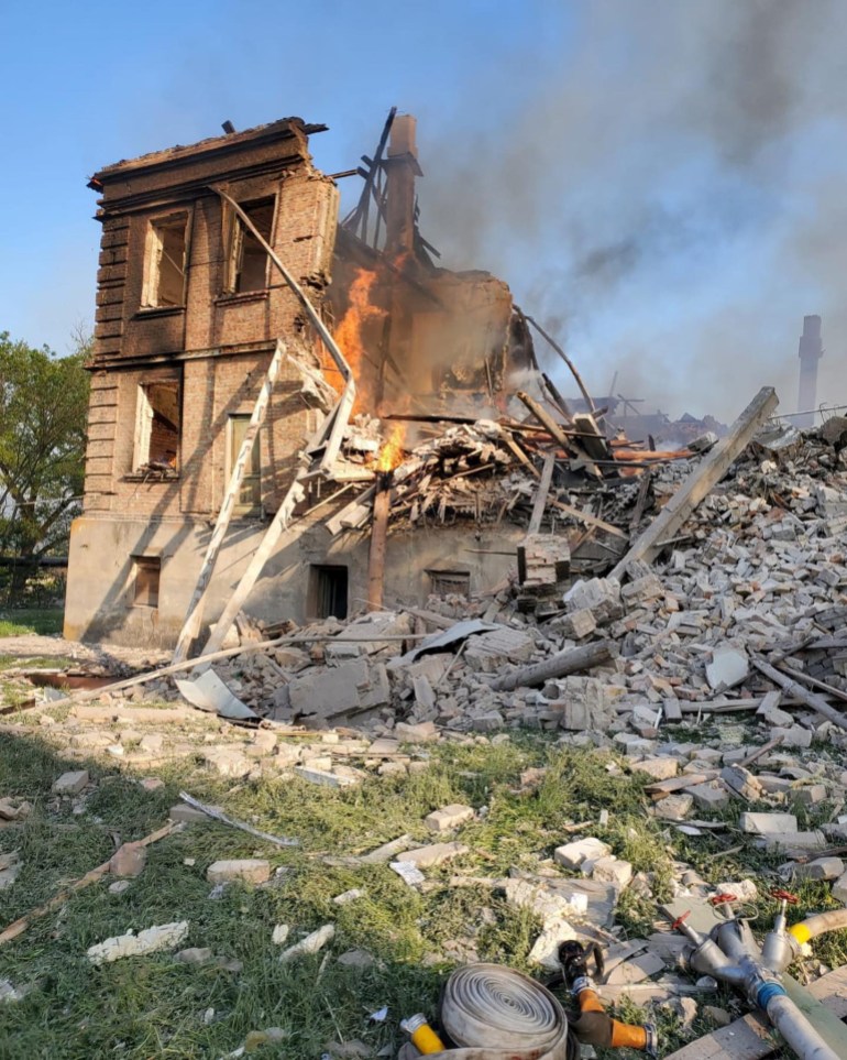 Debris is seen next to a partially collapsed building is seen, after a school building was hit as a result of shelling, in the village of Bilohorivka, Luhansk, Ukraine