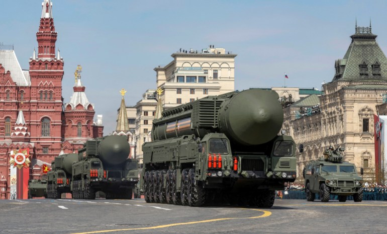 Russian military vehicles, including Yars intercontinental ballistic missile systems, drive in Red Square during a rehearsal for a military parade