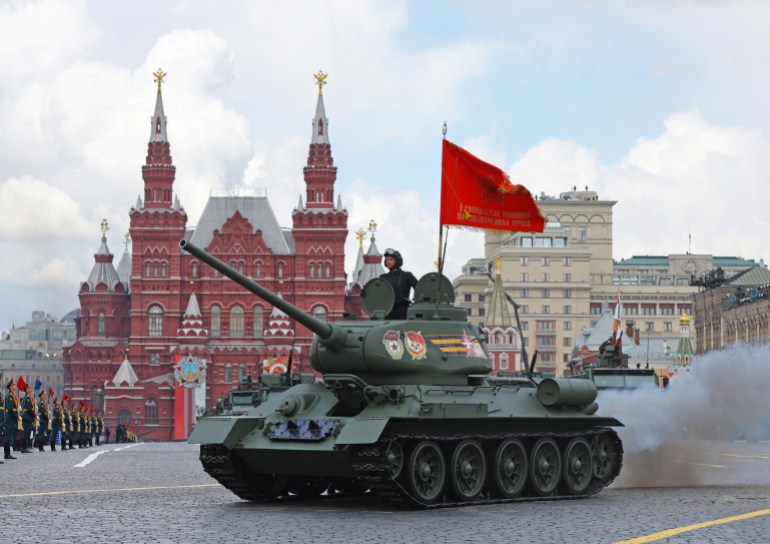A T-34 Soviet-era tank drives in Red Square during a parade on Victory Day