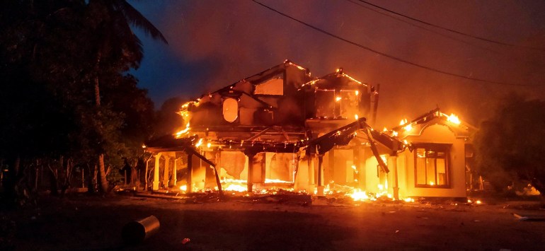A property belonging to a government minister is consumed by flames in Sri Lanka