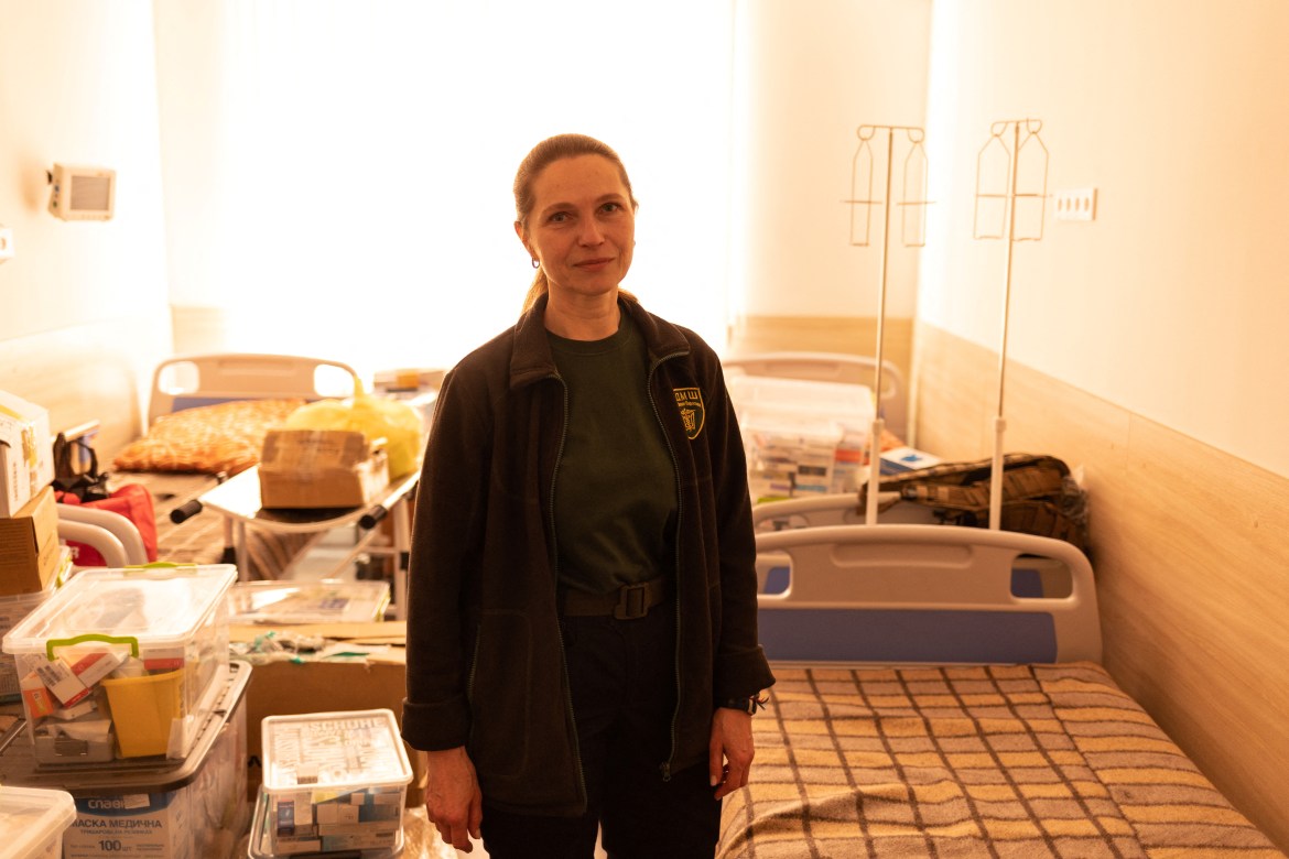 Ukrainian paramedic Svitlana Druzenko, from the Pirogov First Volunteer Mobile Hospital, poses for a photo inside a hospital room that is used to store donated medicines arriving from abroad, amid Russia's invasion in Ukraine