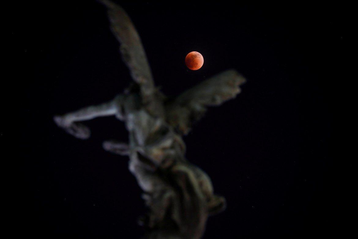A full moon moves through the shadow of the earth during a "Blood Moon" lunar eclipse in San Salvador, El Salvador