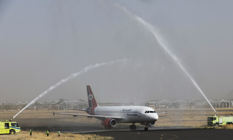 A Yemen Airways plane is greeted with water canon salute at Sanaa Airport 