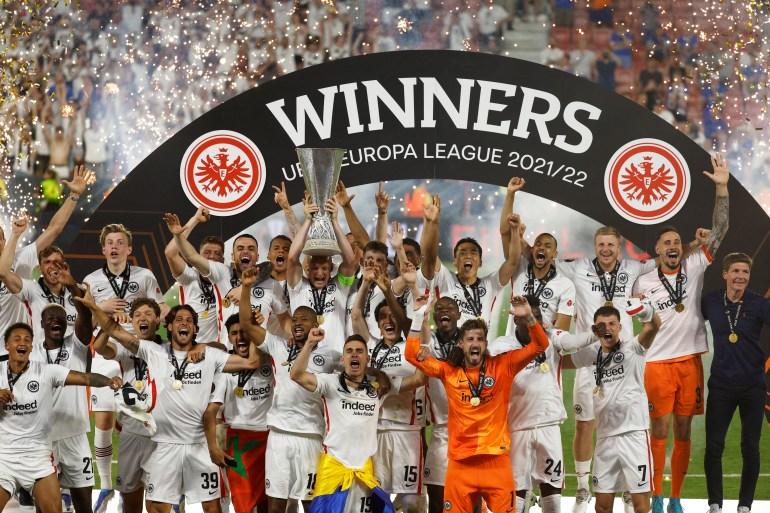 Eintracht Frankfurt's Sebastian Rode lifts the trophy as he celebrates with teammates after winning the Europa League