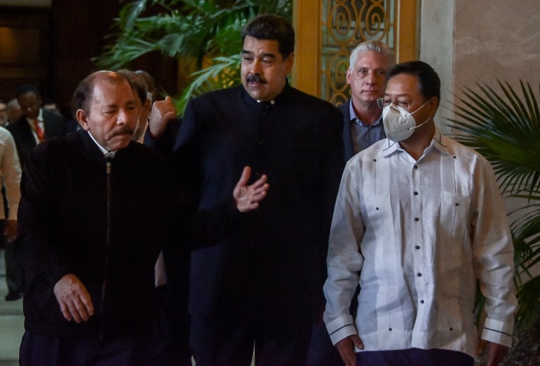 icaragua's President Daniel Ortega, Venezuela's President Nicolas Maduro, Bolivia's President Luis Arce and Cuba's President Miguel Diaz-Canel walk before attending a two-day meeting with ALBA group representatives at the Revolution Palace in Havana, Cuba.