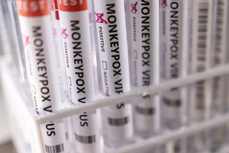 Test tubes labelled "Monkeypox virus positive"