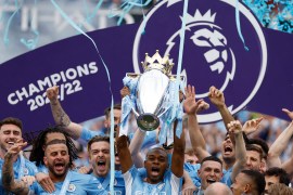 Manchester City&#39;s Fernandinho lifts the trophy with teammates after winning the Premier League on May 22, 2022 [Jason Cairnduff/Reuters]