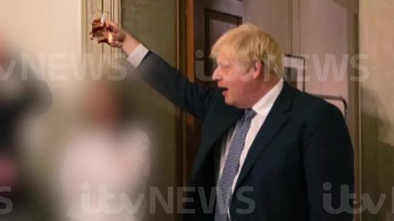 Boris Johnson raising a glass