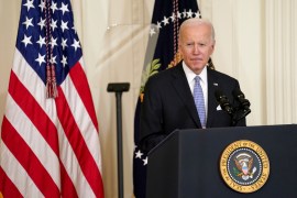 US President Joe Biden stands at a podium at the White House