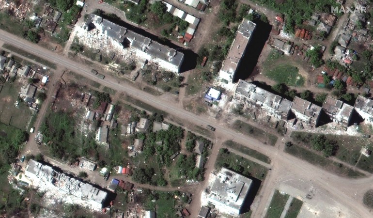 A satellite image shows a Russian armour unit and the aftermath of artillery bombardments, amid Russia's invasion of Ukraine, in Popasna, Luhansk region, Ukraine